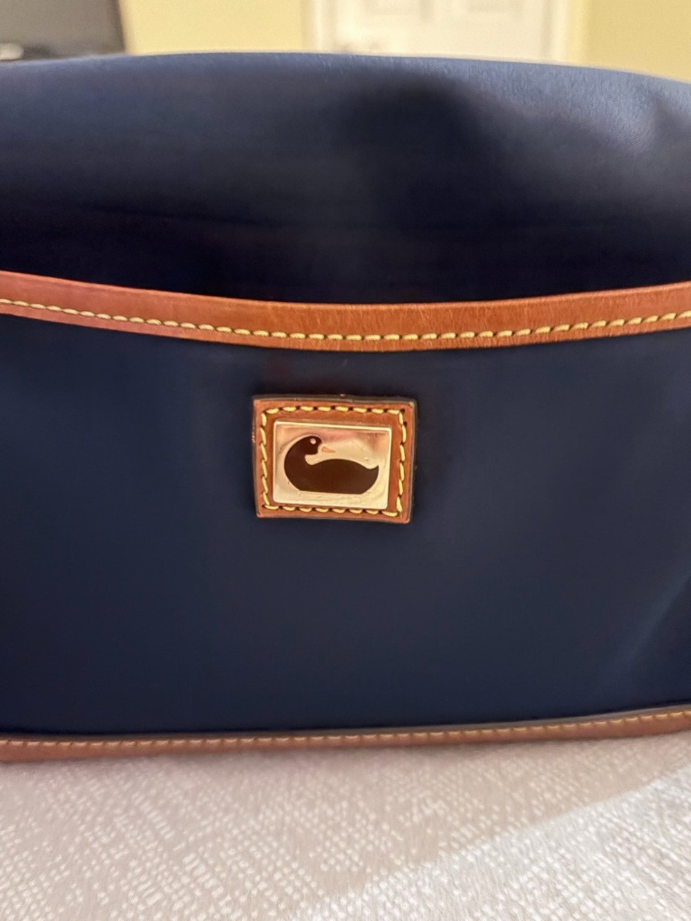 Dooney & Bourke Navy Toiletry Bag with Brown Trim and Gold Logo